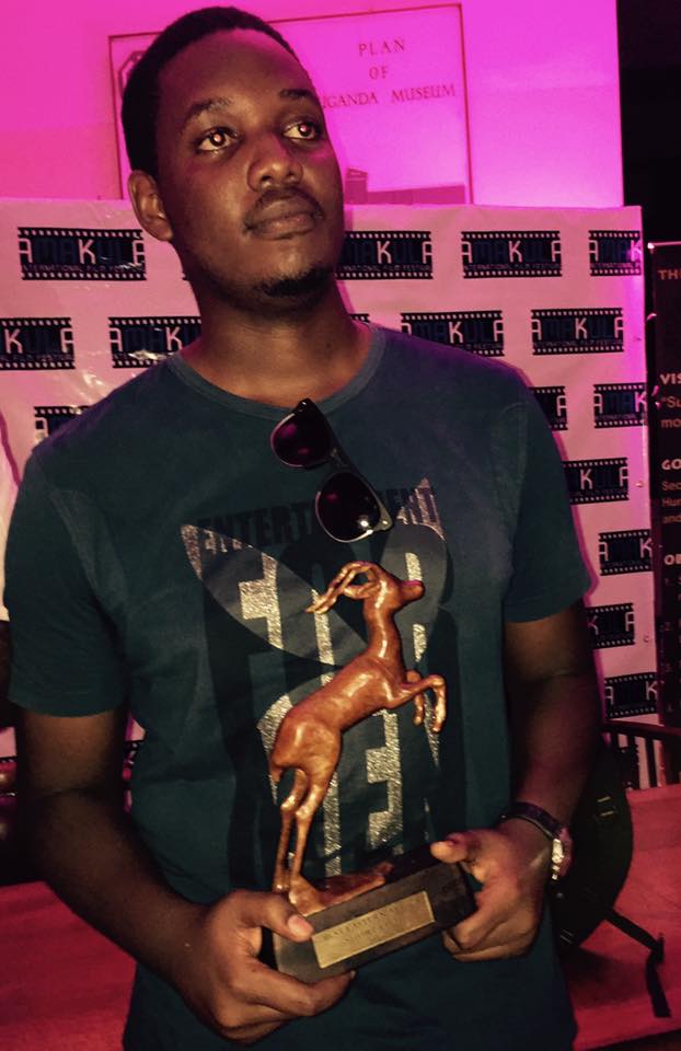 Gary Mugisha with his Golden Impala award